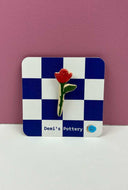 Broche roos