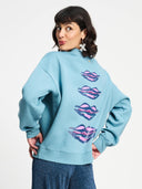 Licht blauwe sweater met opdruk