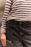 riem buckle logo