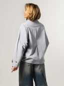 Lichtblauwe cape jas