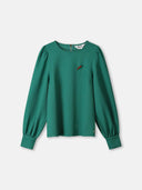 Groene top met broche kae pine green