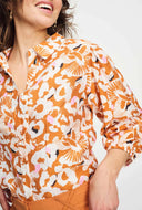Oranje blouse met print adventure