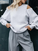 Grijze sweater met cut outs