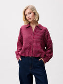 Rode blouse met tuck in effect