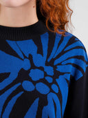 Zwarte sweater met bloem limhamn