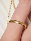 Gouden ovale bangle met kliksysteem