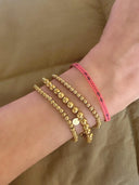 Gouden balletjes armbandje (m)