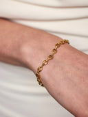 Gouden armband met ovale opengewerkte schakels