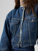 Blauwe kraagloze sherpa trucker jacket