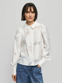 Witte blouse orkidea