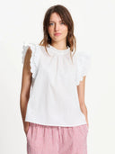 Off-white top met ruffles