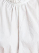 Off-white top met ruffles